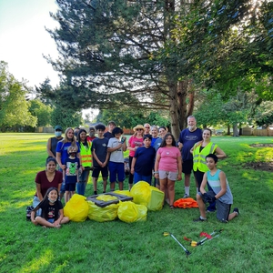 volunteers with bagged trash